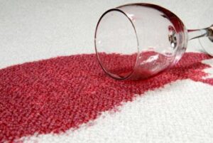 Photo shows a red wine stain on carpet