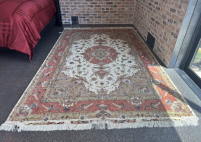 Picture shows a Persian Nagshe Tabriz area rug